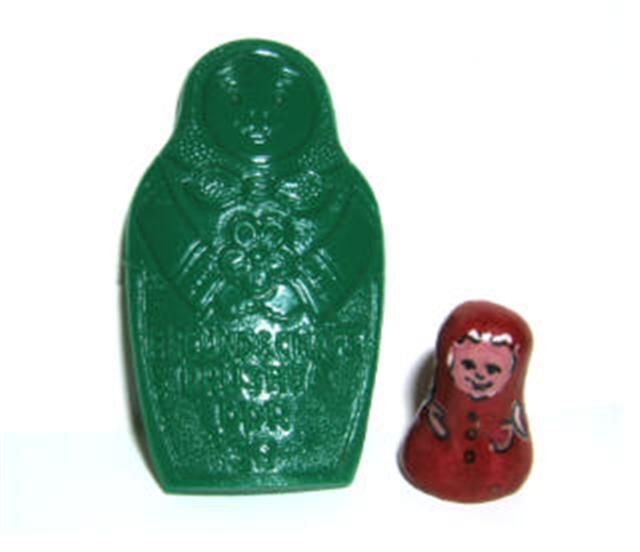 PB18A+B. What Is It Pin (German) 2", PB18B. What Is It Mini Clay Doll 5/8"