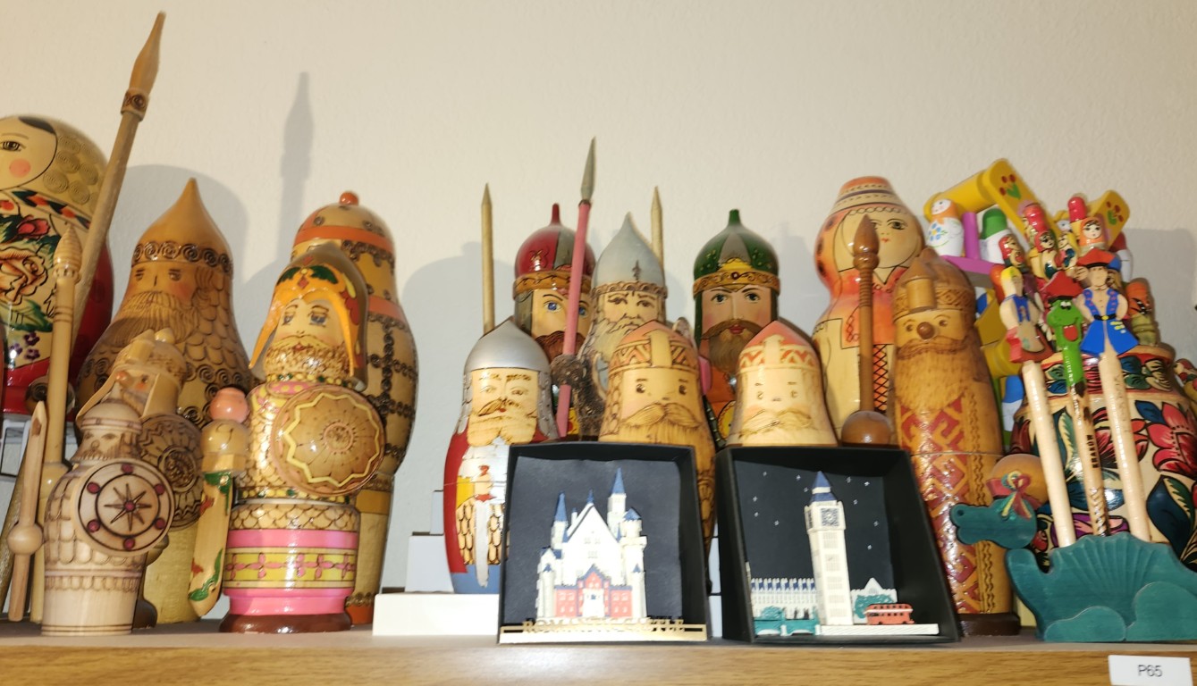 Shelf-B0. Tall bottle holders and warriors.